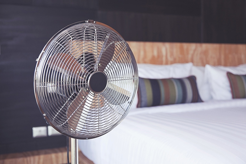 Improve Your Home’s Indoor Air Quality. Electric fan in bedroom.